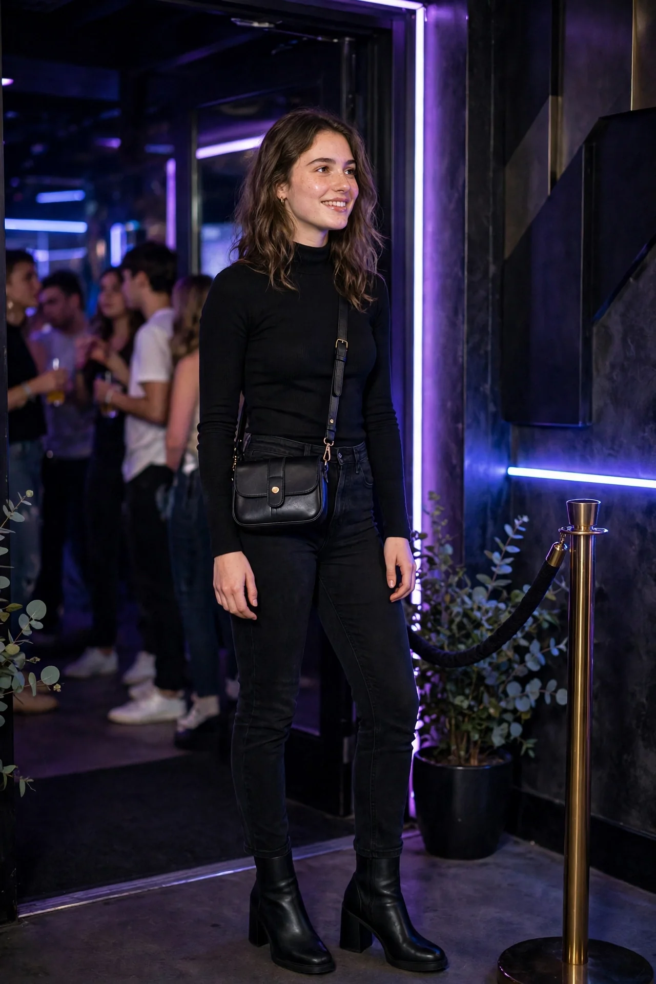 Girl in an all-black club outfit